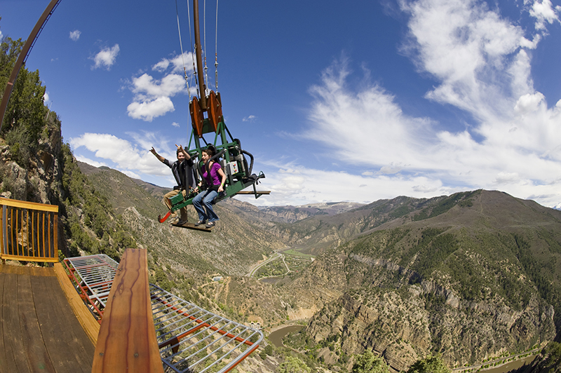 Amusement Park Ride with Man and Woman on Swing